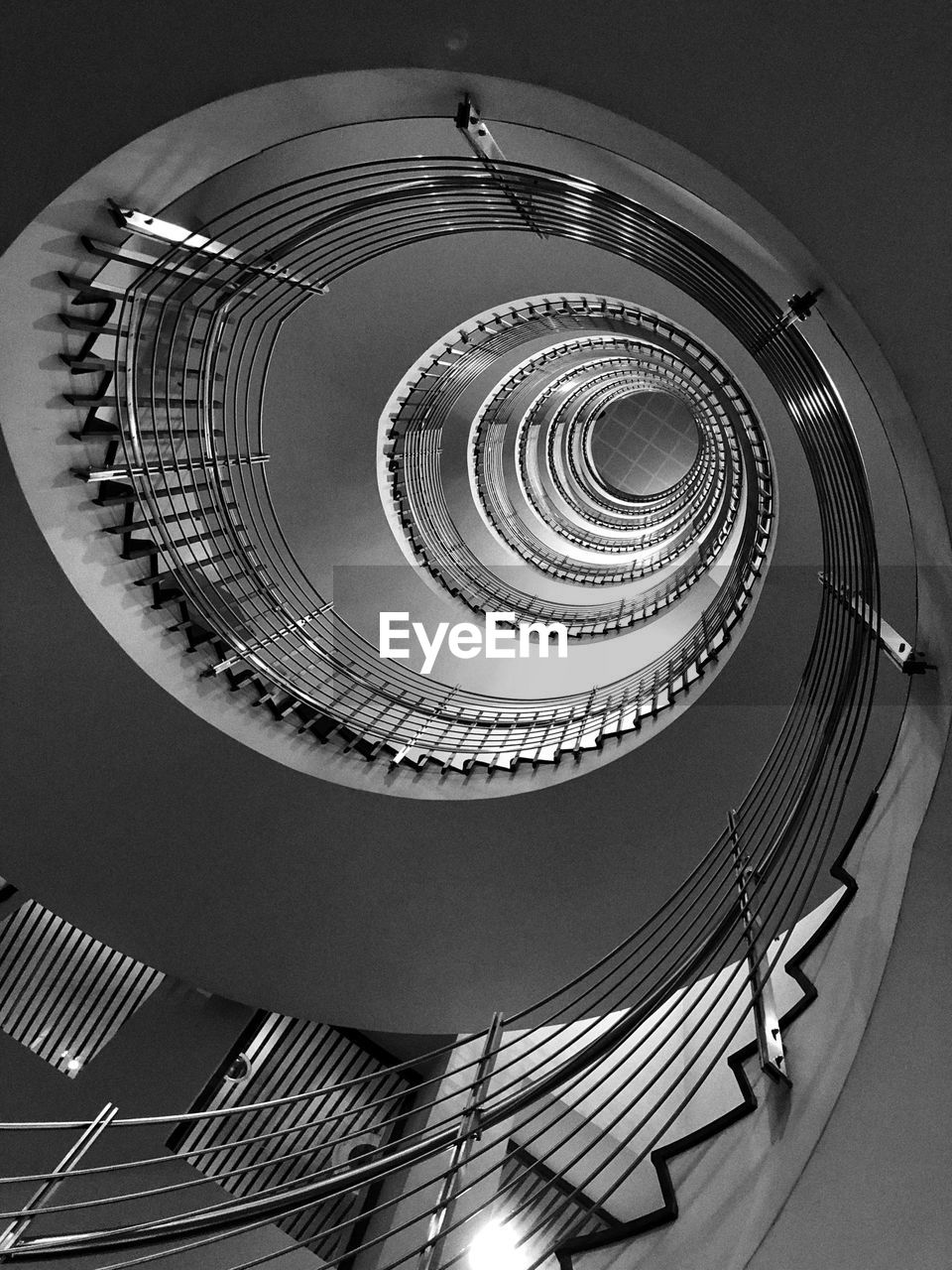 DIRECTLY BELOW SHOT OF SPIRAL STAIRCASE