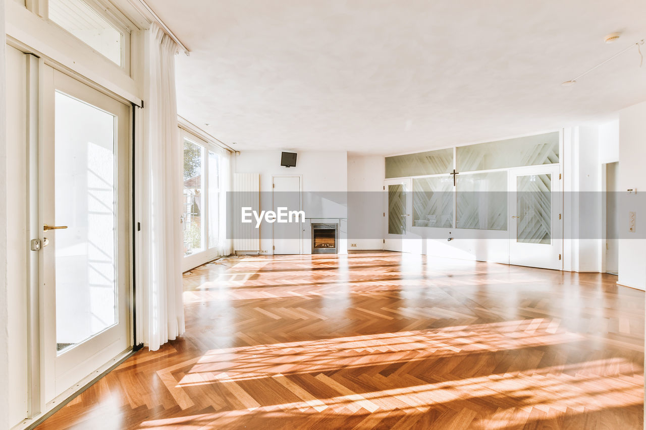 INTERIOR OF EMPTY ROOM WITH BUILDING