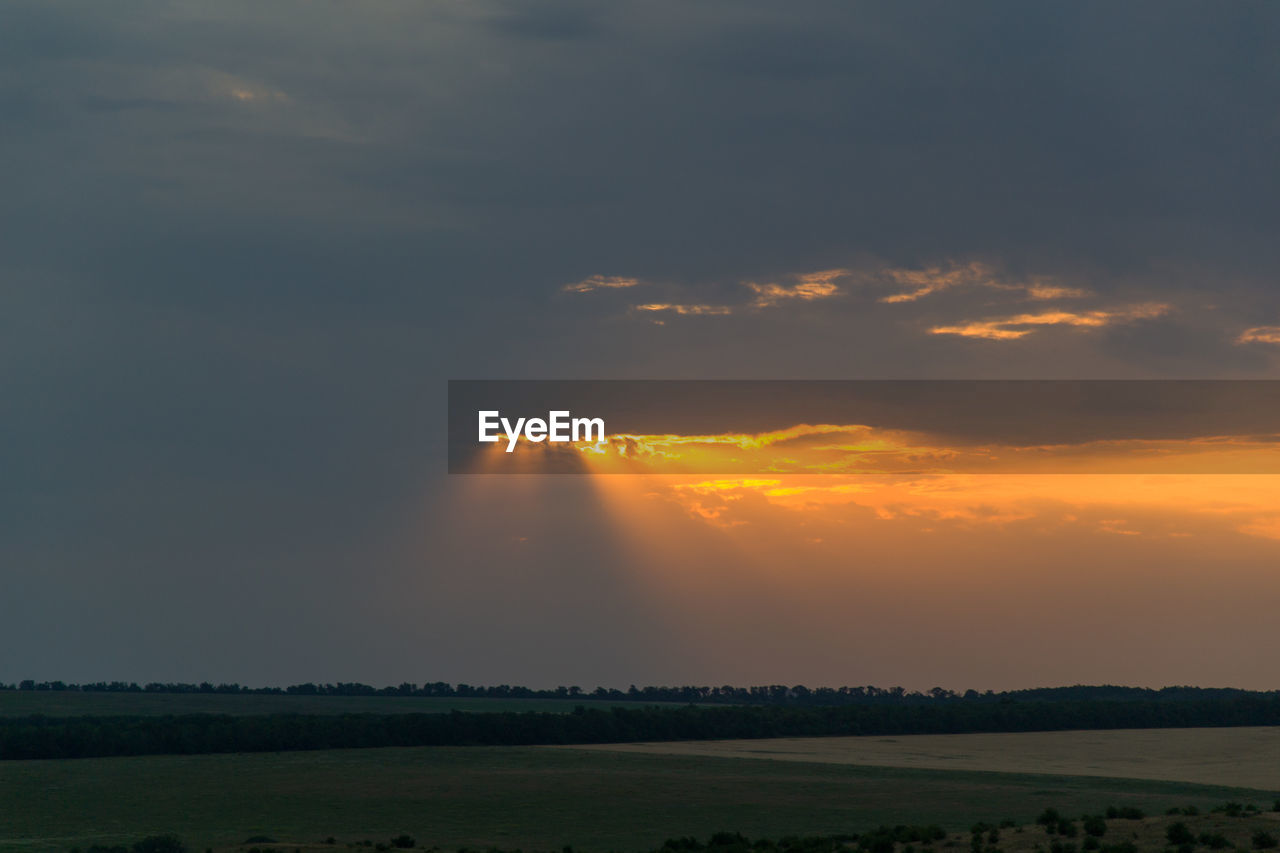 SCENIC VIEW OF SUNSET OVER LAND