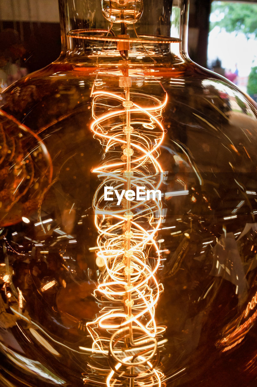 Close-up of illuminated light bulb