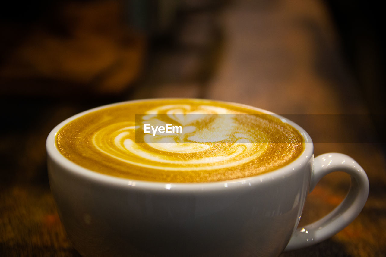 Close-up of cappuccino on table