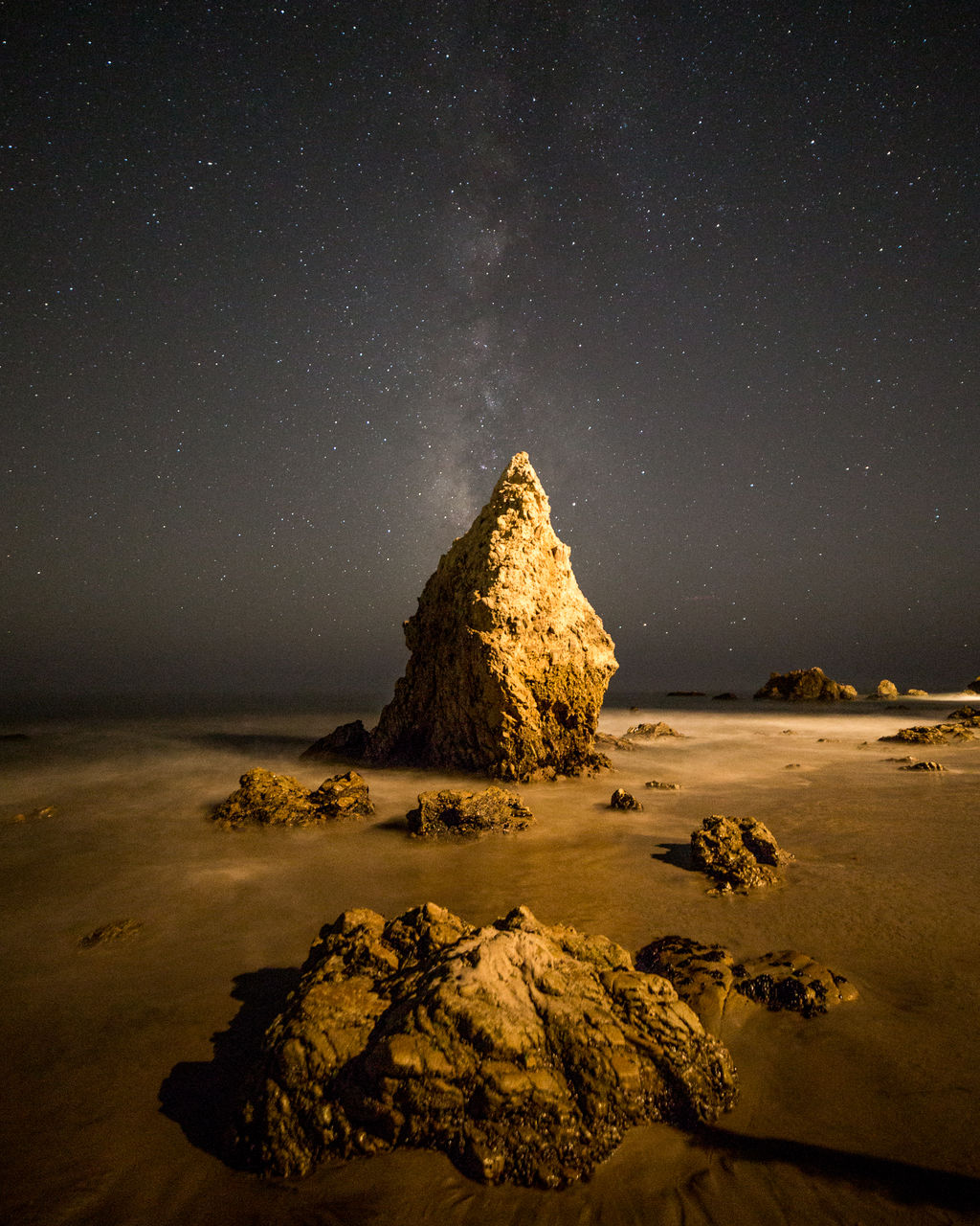 Scenic view of sea against sky at night