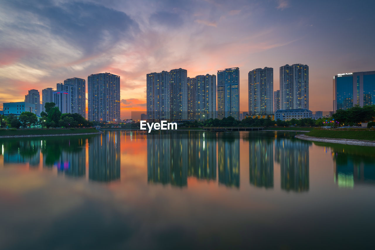 Brilliant apartments is reflected at the sunset in ha noi, vietnam