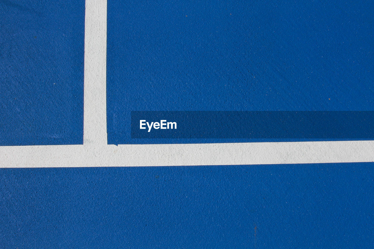 Blue training tennis court with white line , top view