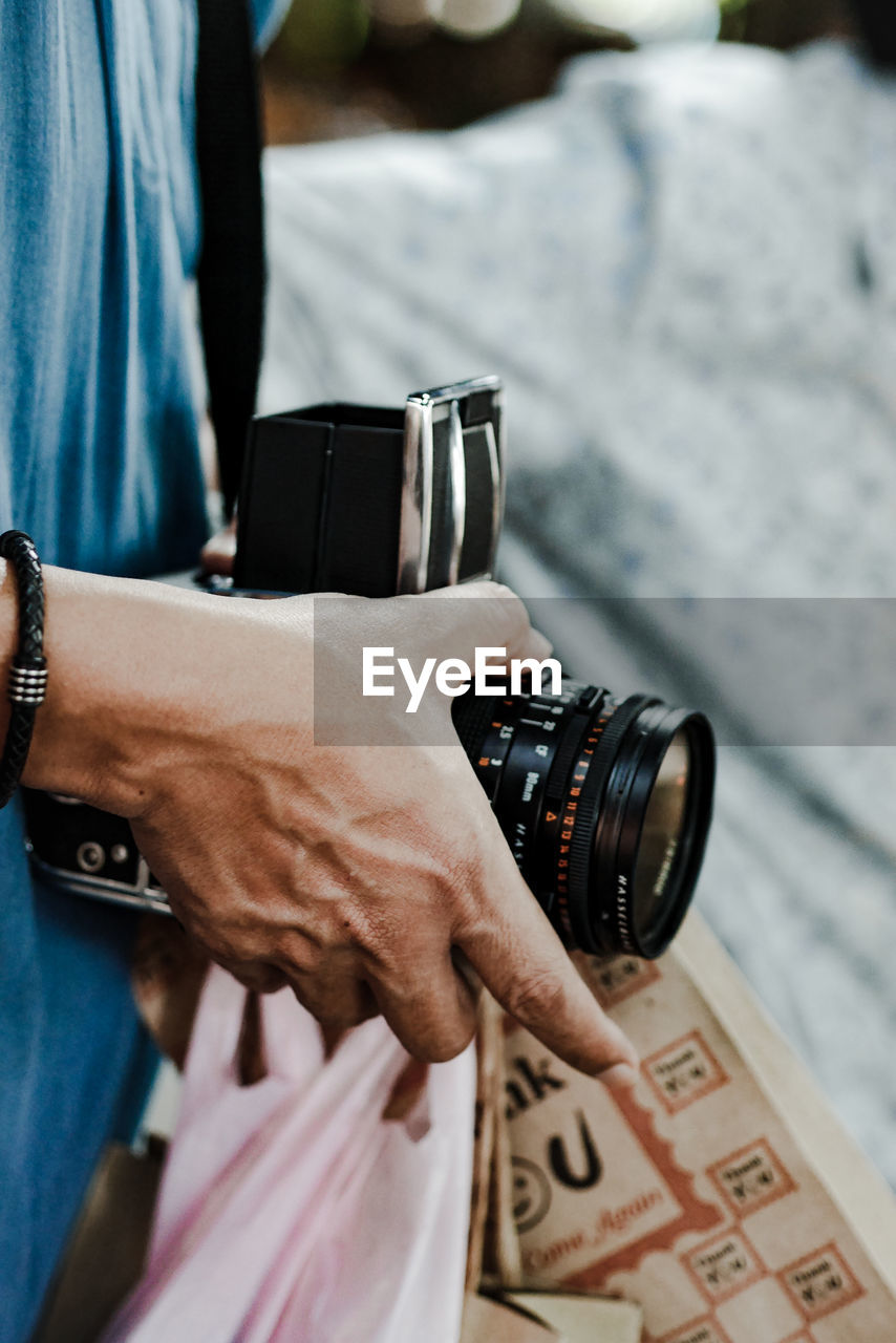 Close-up of man holding camera