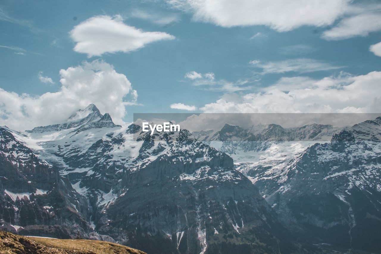 Scenic view of snowcapped mountains against sky