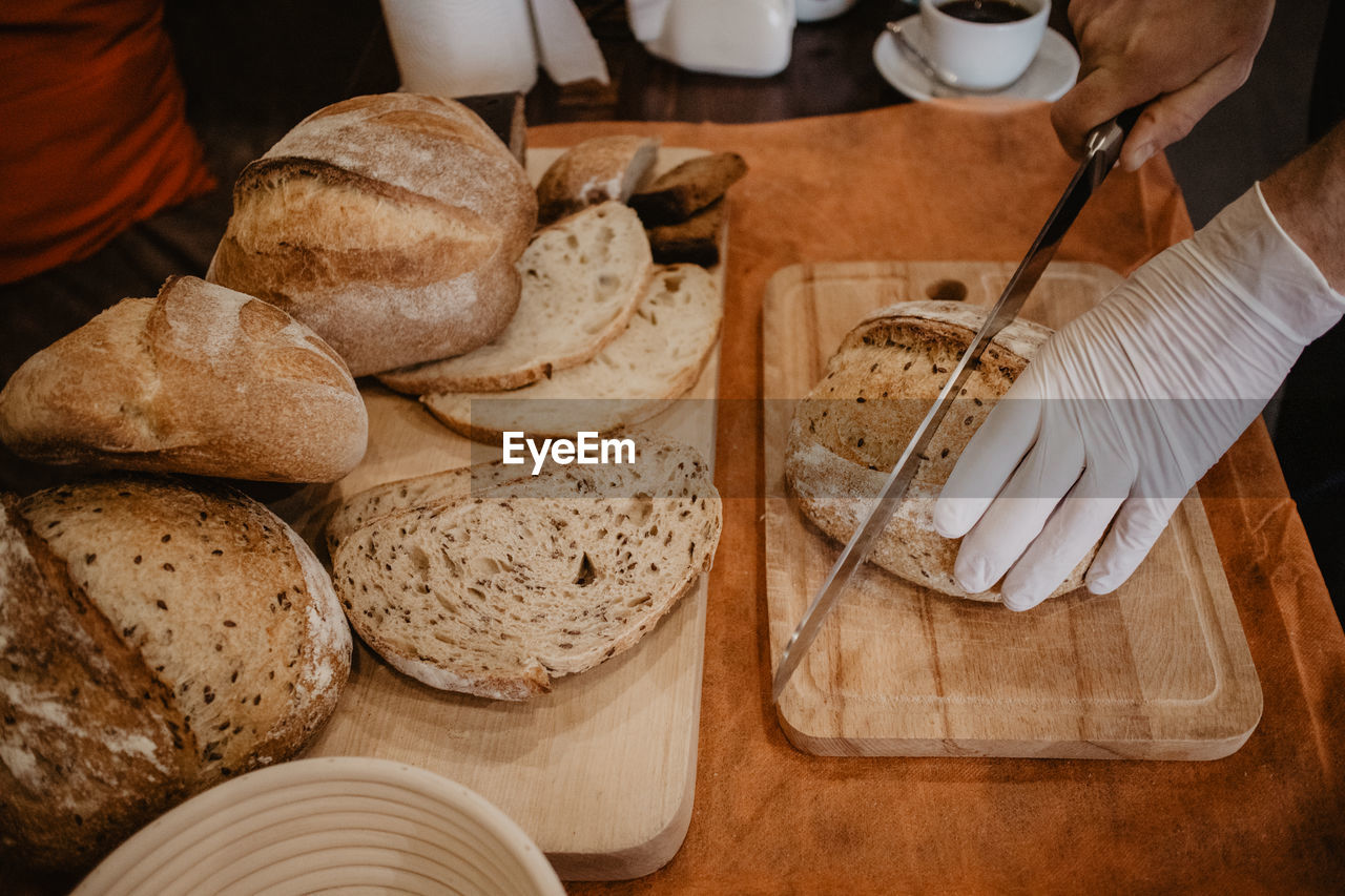 High angle view of food on table / cutting bread