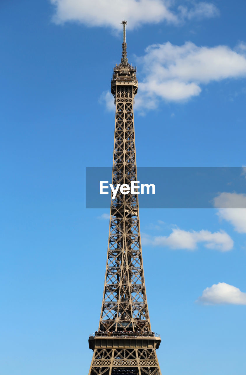 Eiffel tower in paris france with blue sky and some white clouds