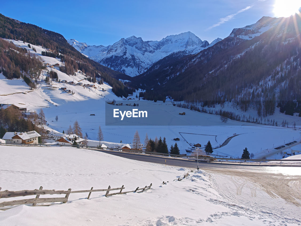 snow, winter, cold temperature, mountain, environment, scenics - nature, landscape, mountain range, beauty in nature, sky, nature, piste, snowcapped mountain, travel, travel destinations, land, skiing, winter sports, ski, sunlight, sun, ski equipment, blue, mountain peak, architecture, tranquil scene, pinaceae, tourism, tranquility, coniferous tree, leisure activity, tree, forest, vacation, sports, ice, frozen, outdoors, pine tree, non-urban scene, plant, ski touring, day, sunny, trip, pine woodland, building, valley, water, resort, holiday, ski mountaineering, built structure, nordic skiing, ridge, activity, idyllic, adventure, building exterior, village