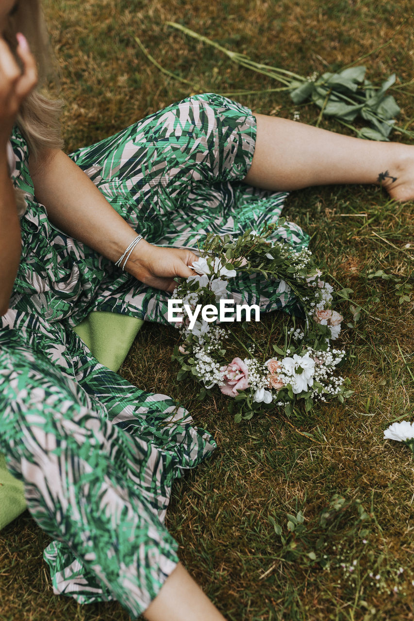 Woman making floral wreath