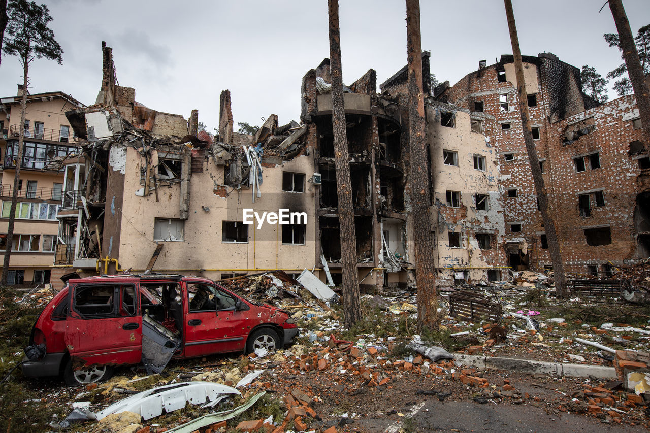 Cities of ukraine after the russian occupation. destroyed buildings on the streets of irpen.