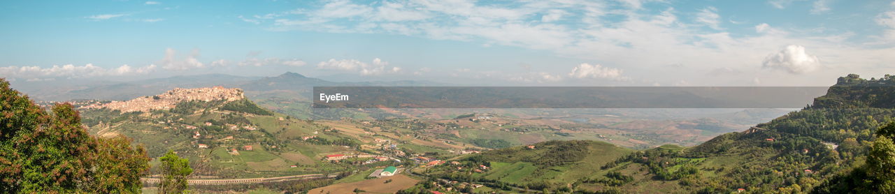 PANORAMIC VIEW OF LANDSCAPE AND TREES AGAINST SKY