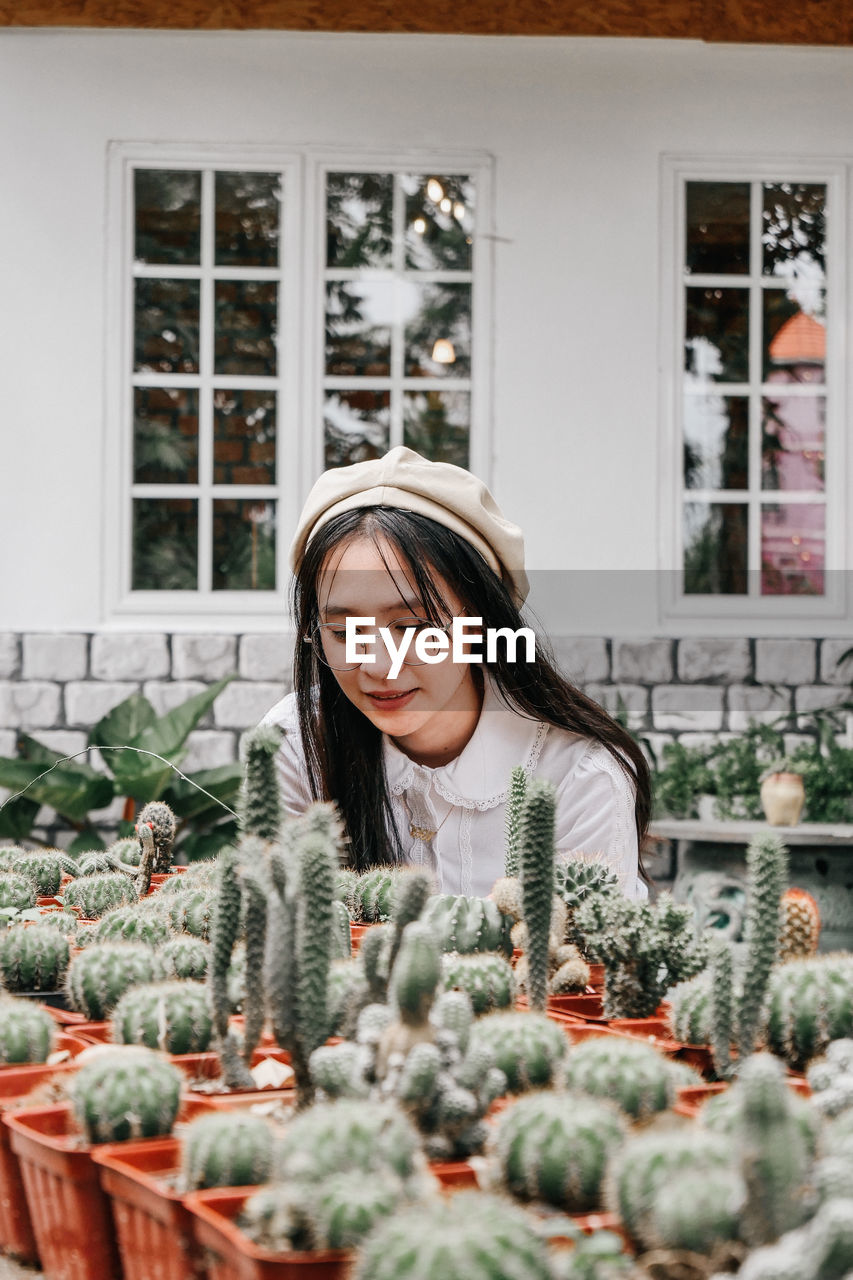 Smiling woman in plant store