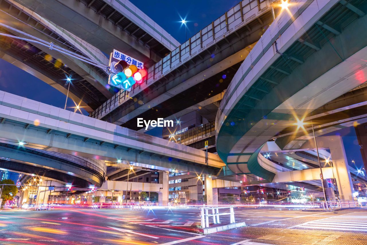 low angle view of modern buildings at night