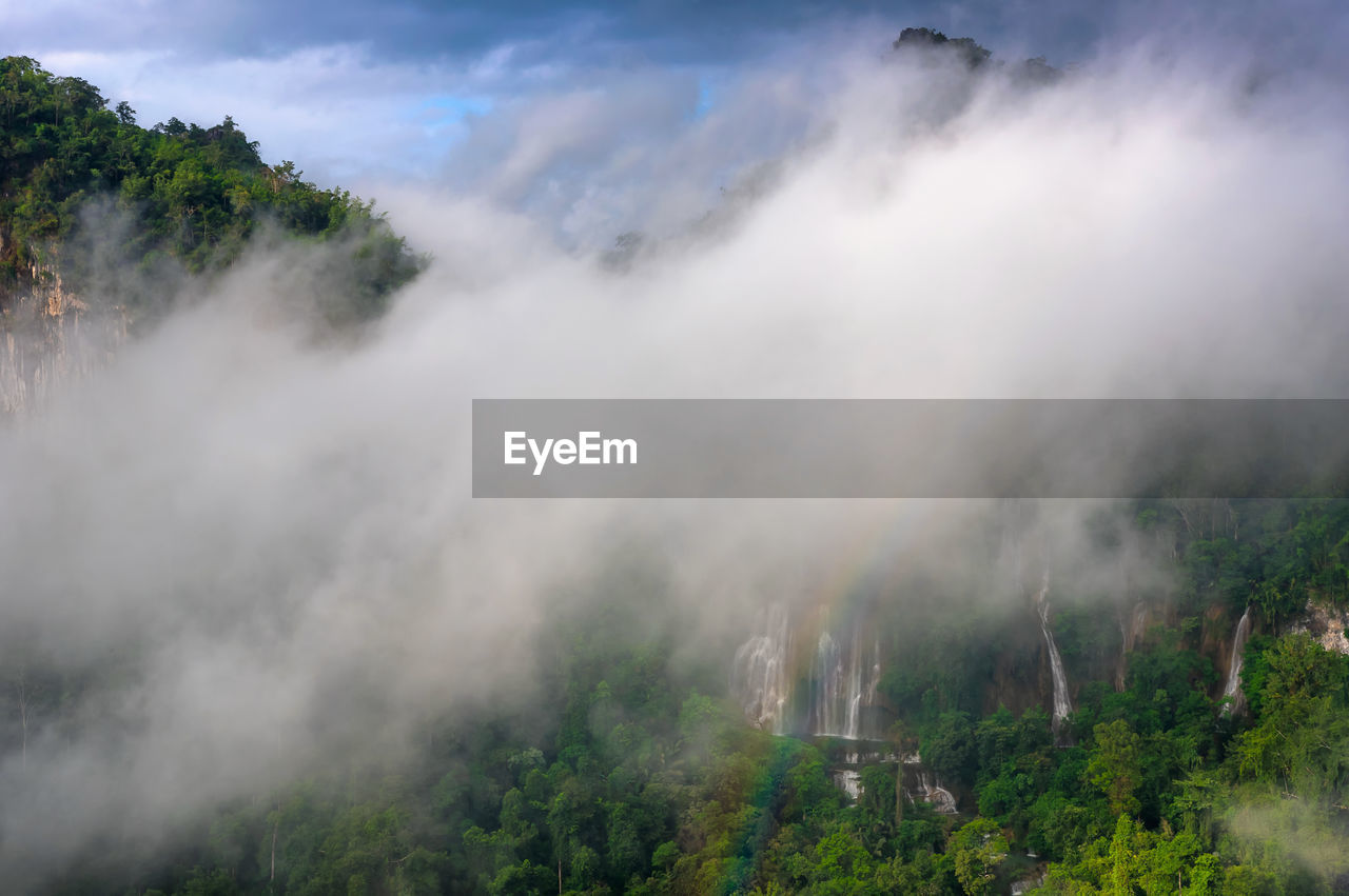 Fog and rainbow in front of thi lo su waterfall, umphang national park, tak, thailand.