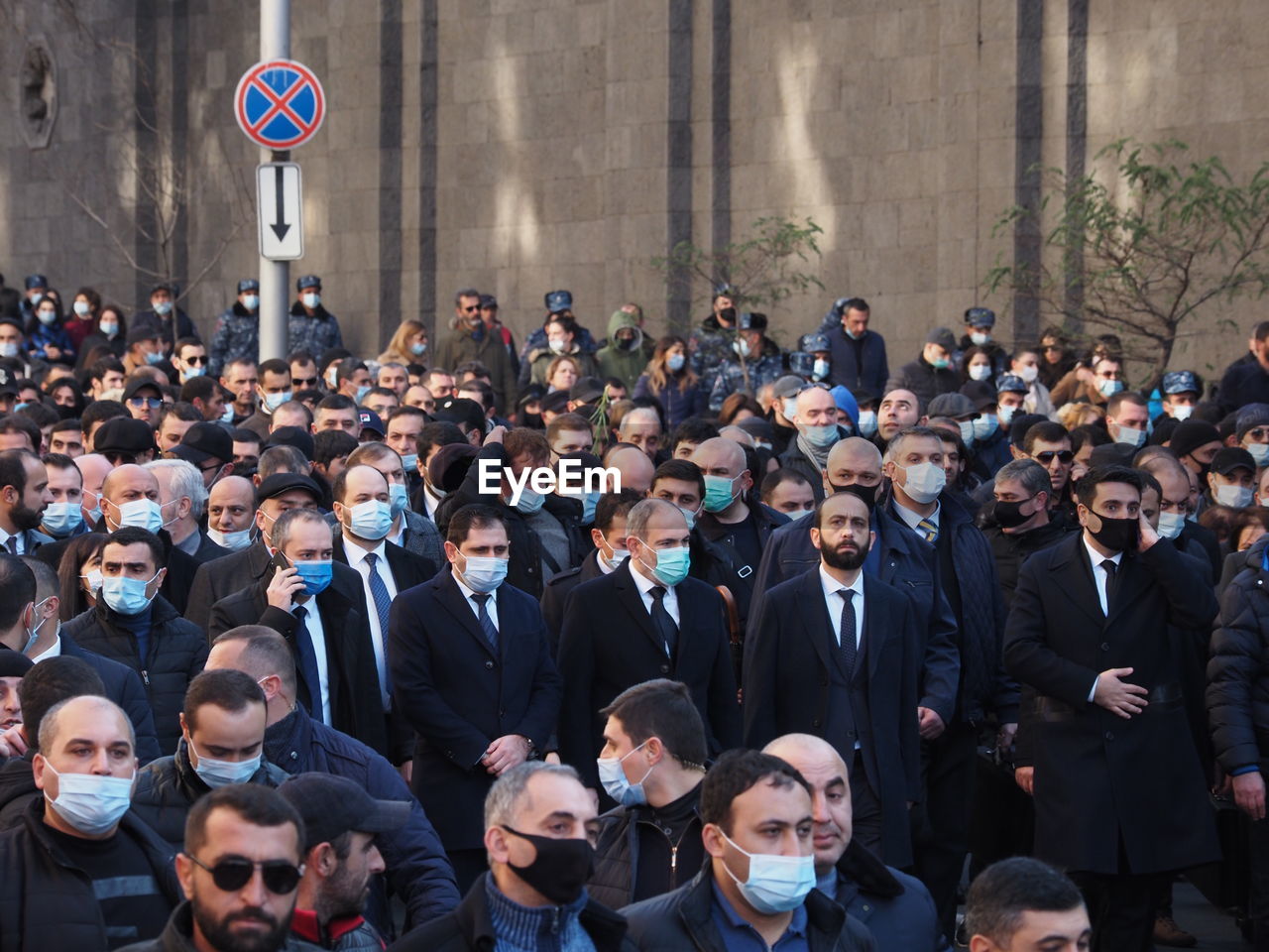 GROUP OF PEOPLE STANDING IN CITY