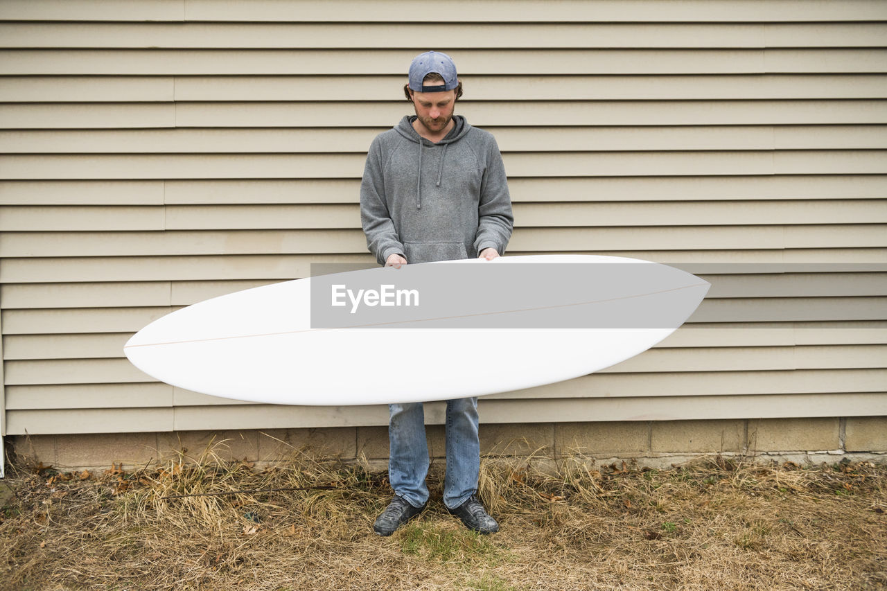 Surfboard shaper refining a new design