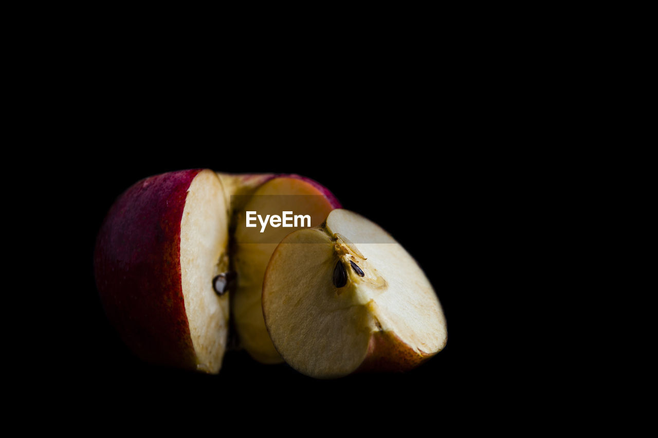 Close-up of apple against black background