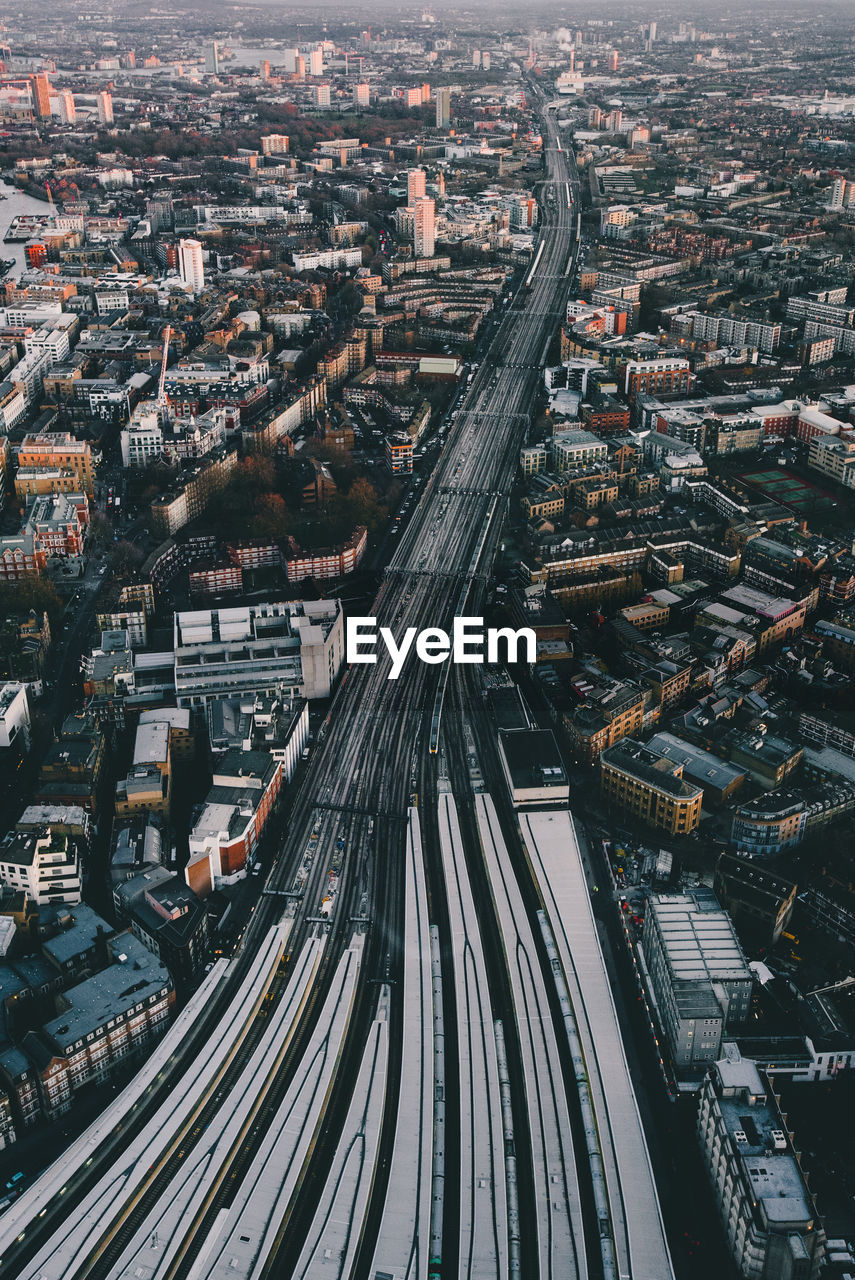 Aerial view of elevated road amidst buildings in city