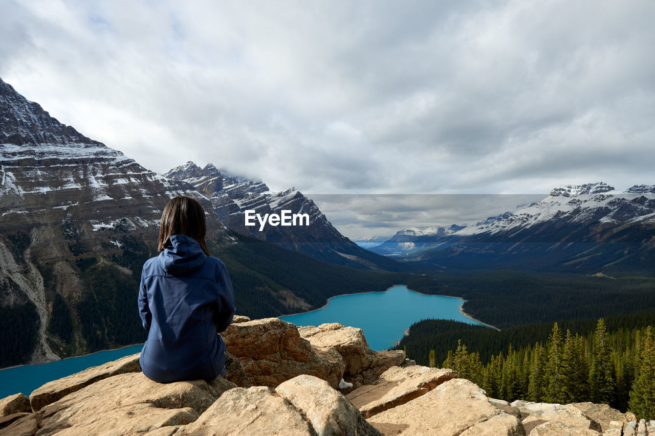 Girl enjoying the view on a hike at peyto lake, banff national park