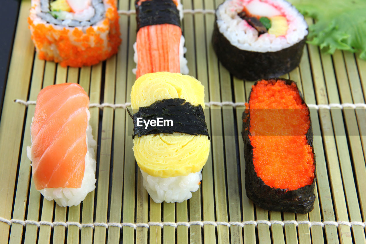 CLOSE-UP OF SUSHI SERVED IN A ROW