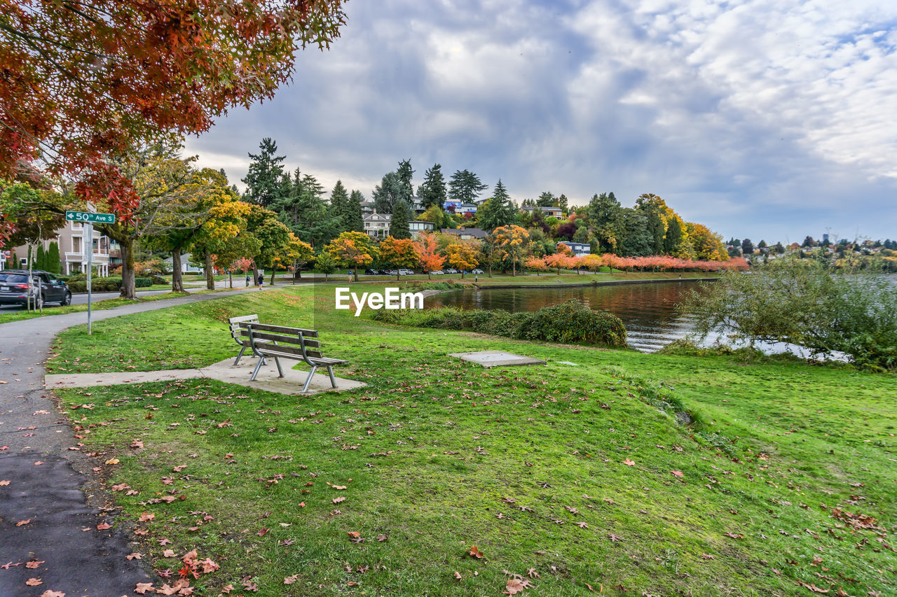 plant, tree, sky, nature, grass, cloud, park, water, beauty in nature, rural area, environment, lawn, no people, tranquility, landscape, garden, green, flower, park - man made space, scenics - nature, architecture, leaf, day, travel destinations, land, autumn, outdoors, tranquil scene, travel, lake, footpath, field, built structure, tourism, city