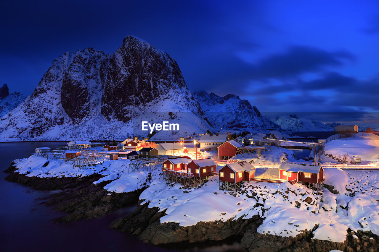 Illuminated fishing village at lofoten island during winter