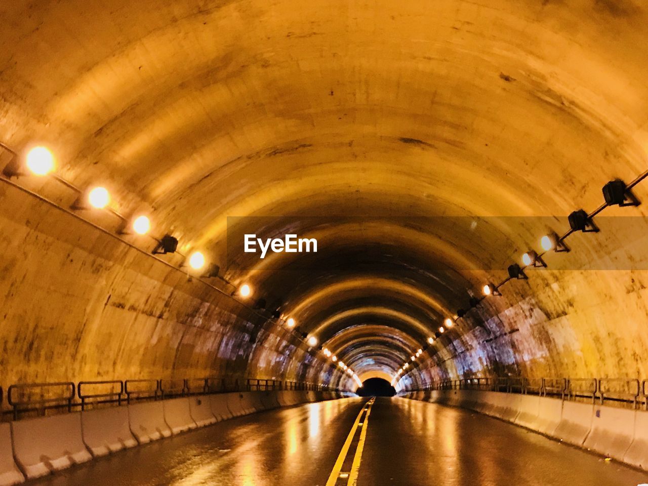 INTERIOR OF ILLUMINATED SUBWAY TUNNEL