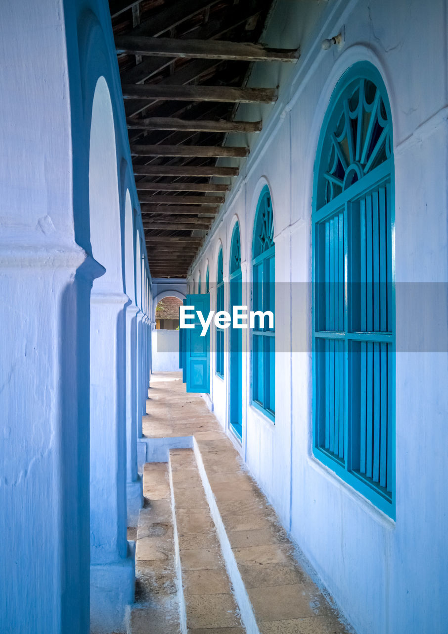 EMPTY CORRIDOR OF BUILDING WITH COLONNADE