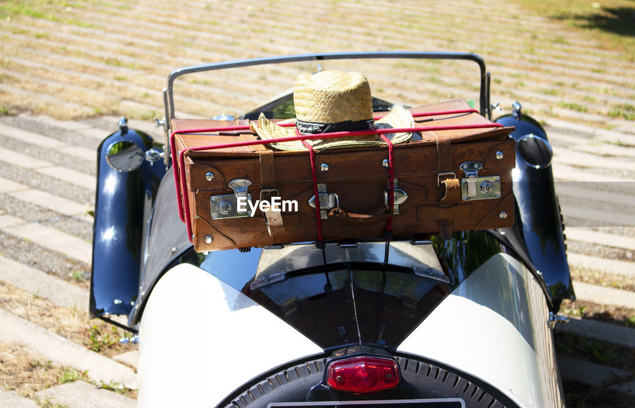 Close-up of vintage car on field