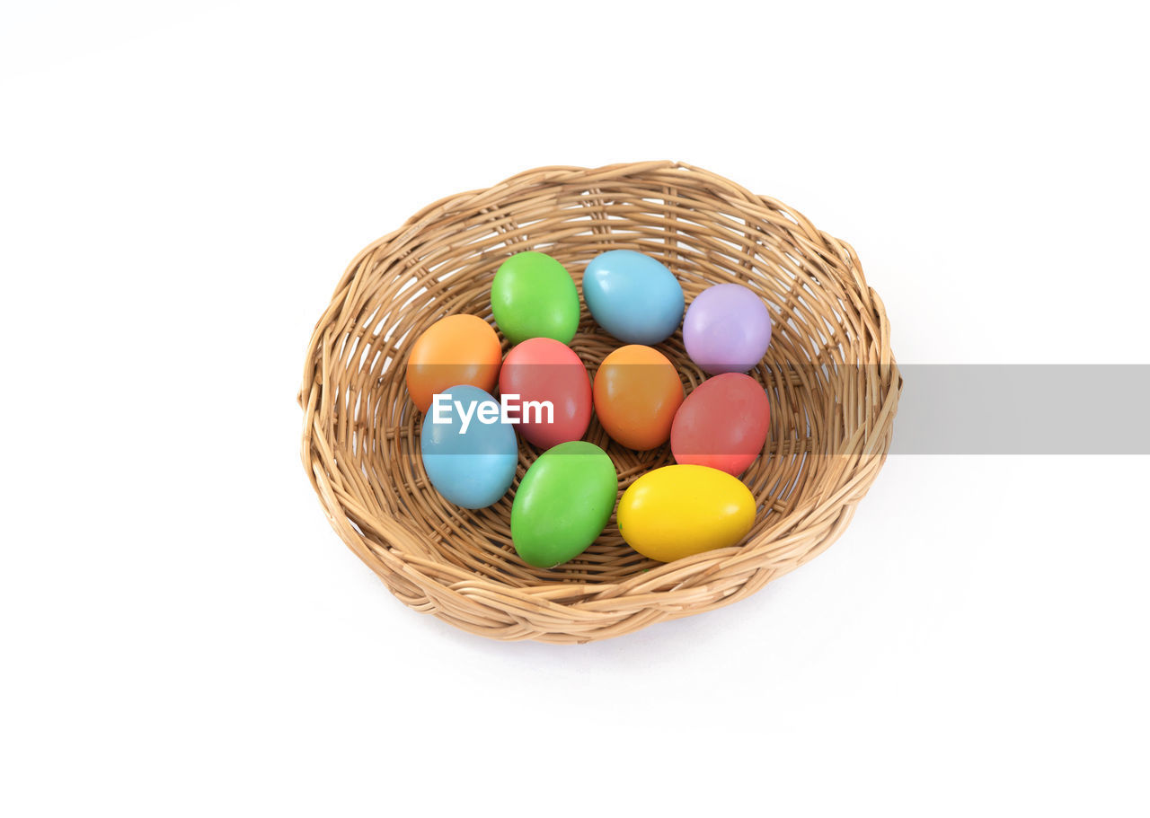 egg, easter, easter egg, celebration, basket, tradition, multi colored, holiday, food, container, food and drink, animal egg, wicker, event, cut out, no people, white background, animal nest, religion, indoors, studio shot, still life, candy, decoration, sweet food