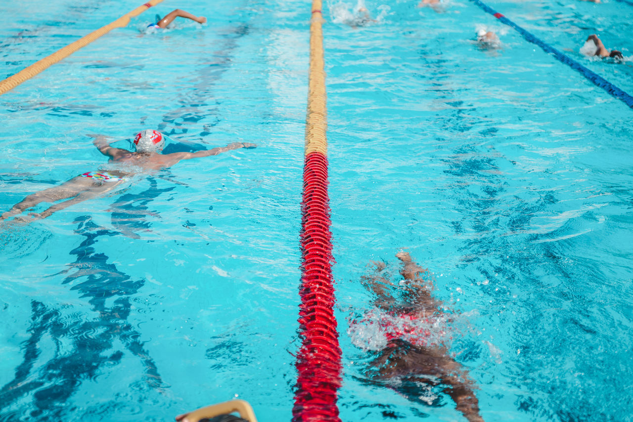 High angle view of people swimming in pool