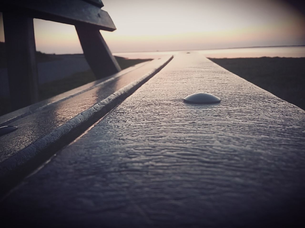 REFLECTION OF SKY IN WATER DURING SUNSET