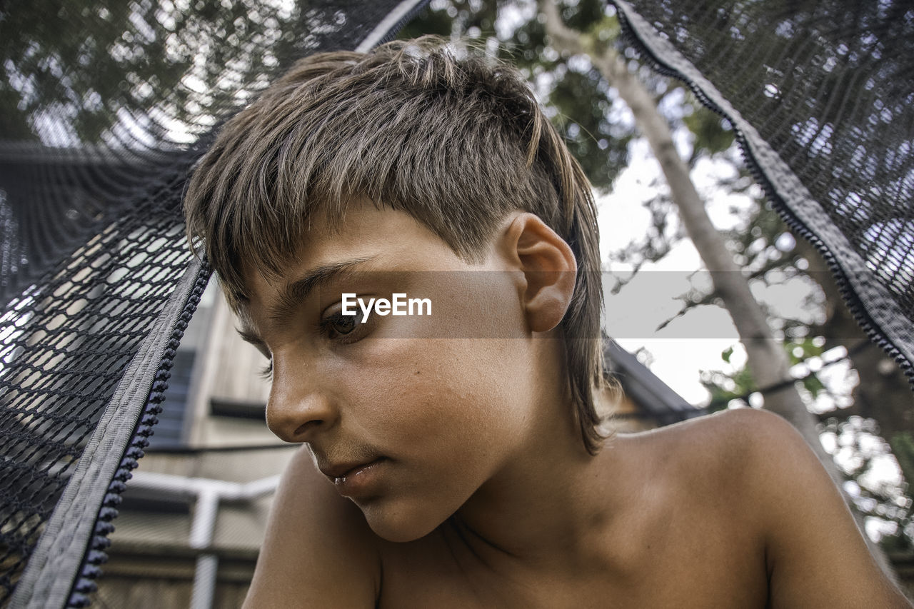 Close-up of young man looking away