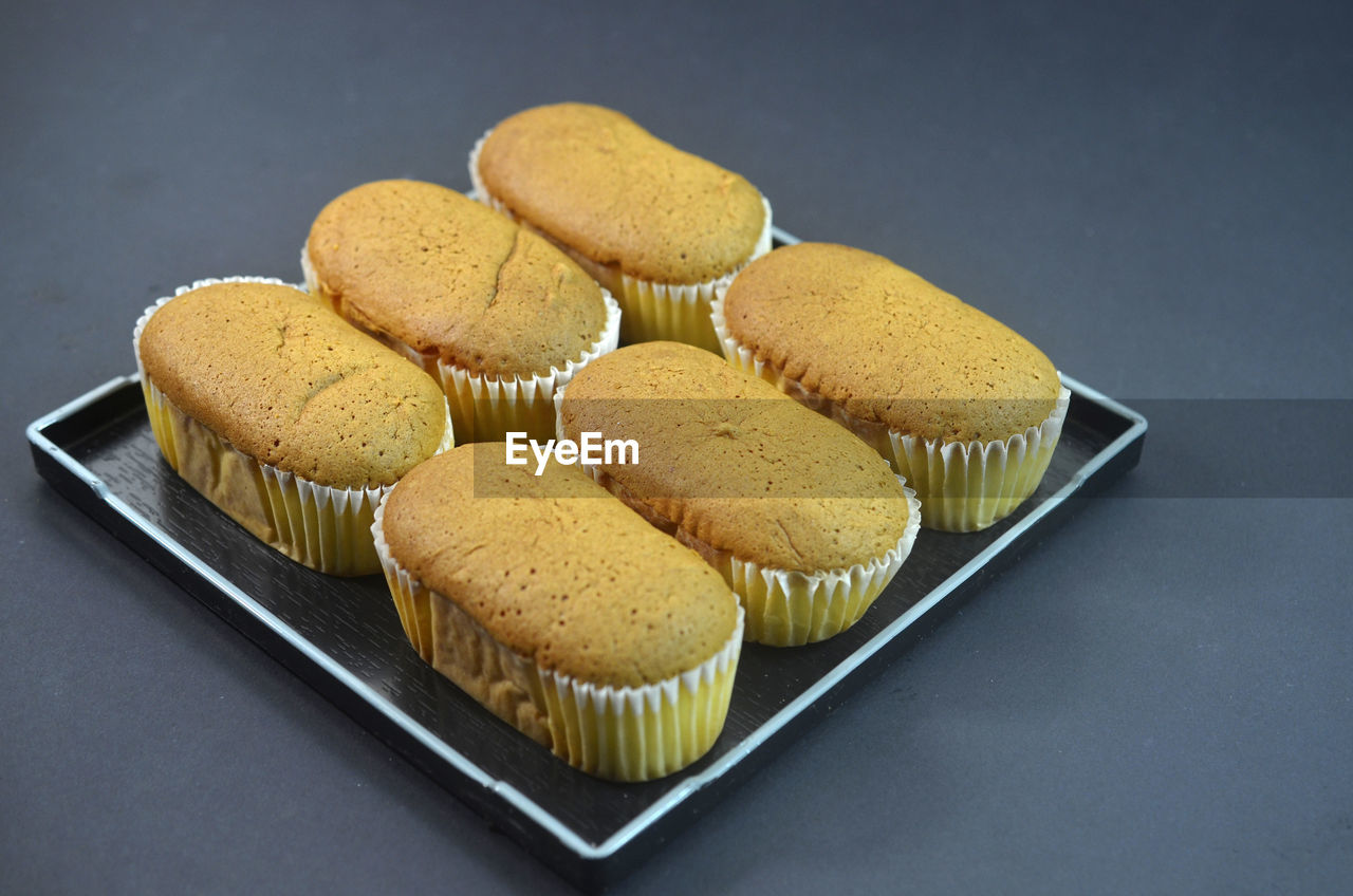 Muffin in a square plate on black table background