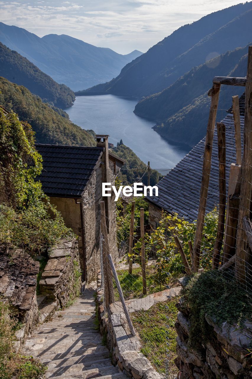 SCENIC VIEW OF MOUNTAINS AND PLANTS AGAINST SKY