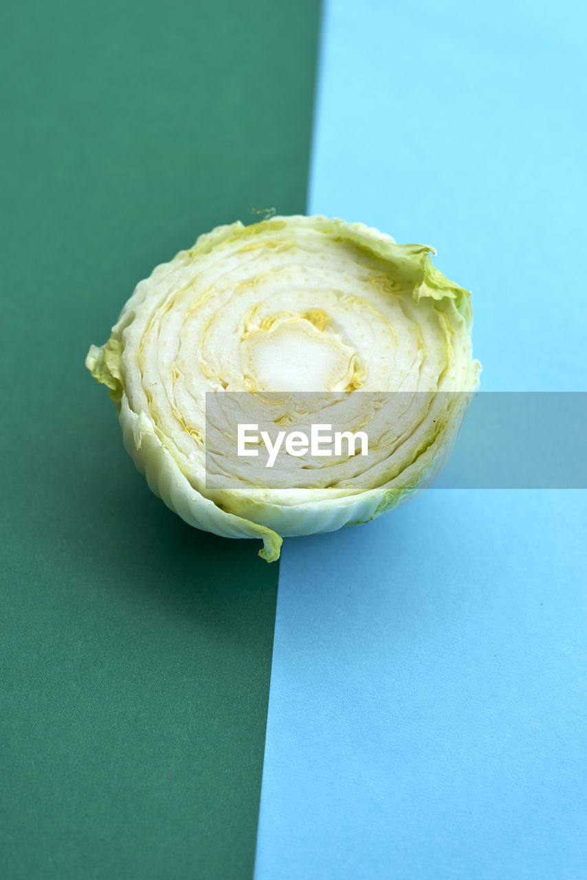 Directly above shot of cabbage on colored background