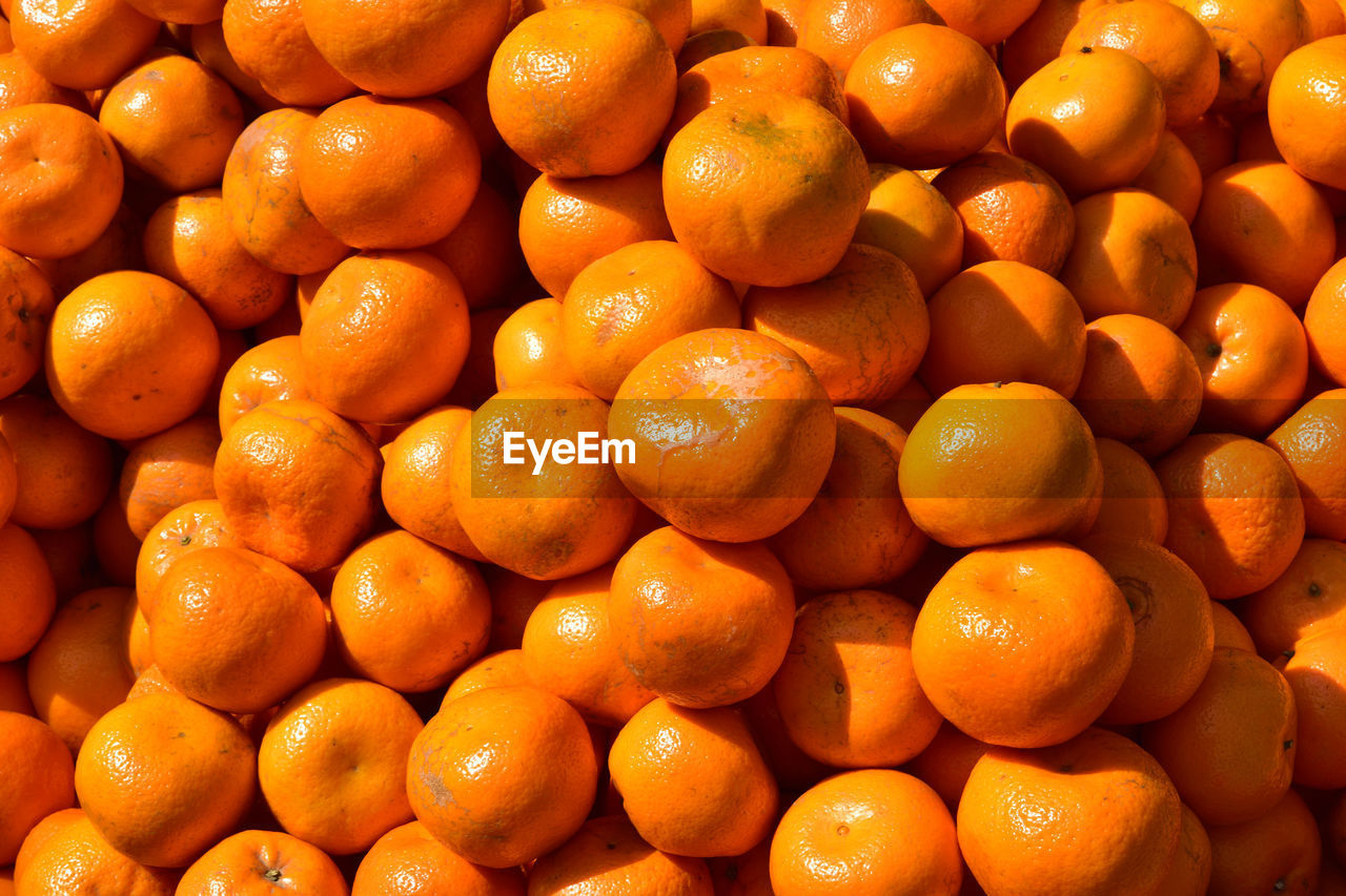 Full frame shot of oranges at market stall