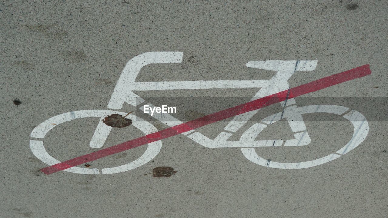 High angle view of no cycling sign on road