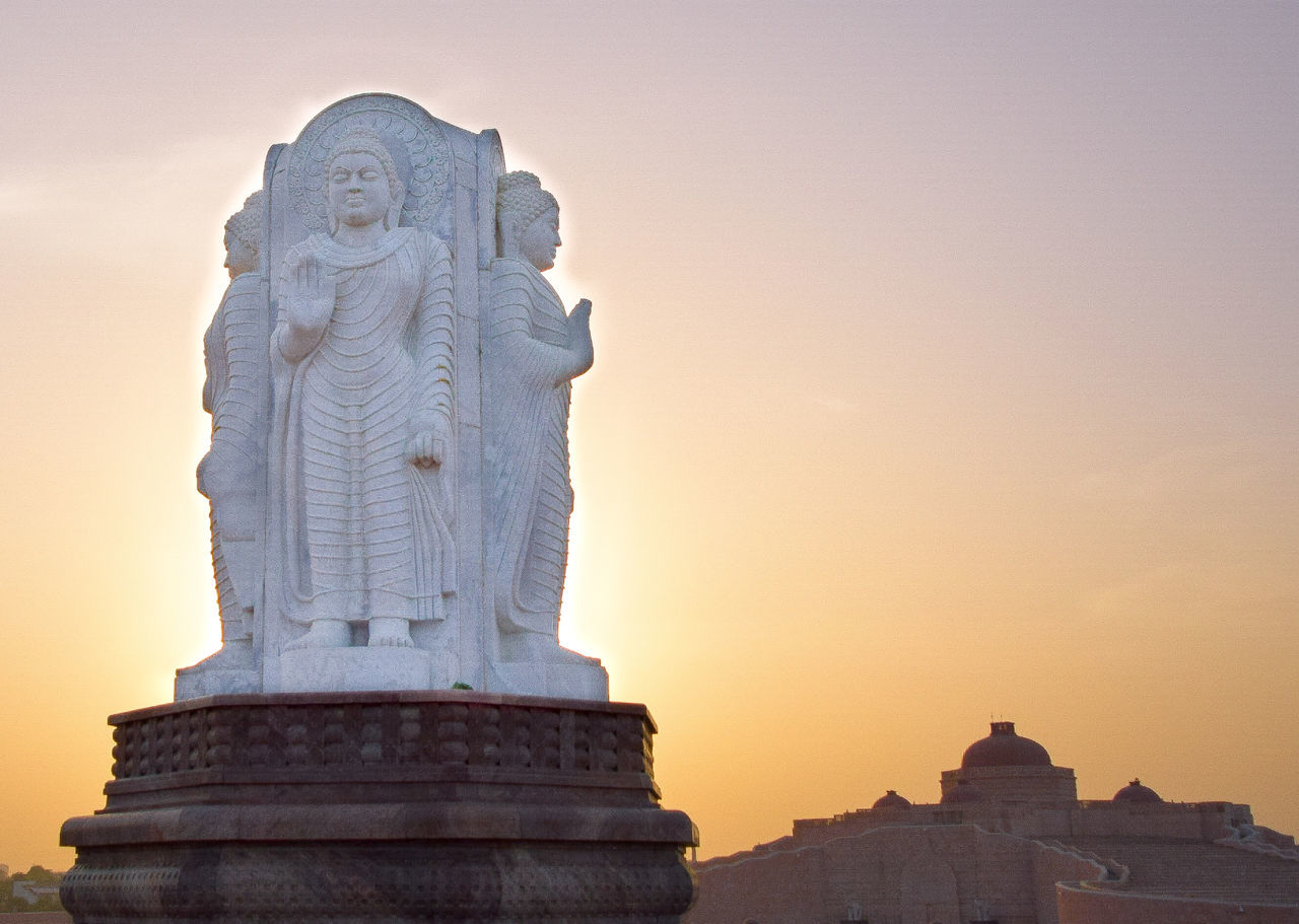 STATUE OF BUDDHA AGAINST SKY