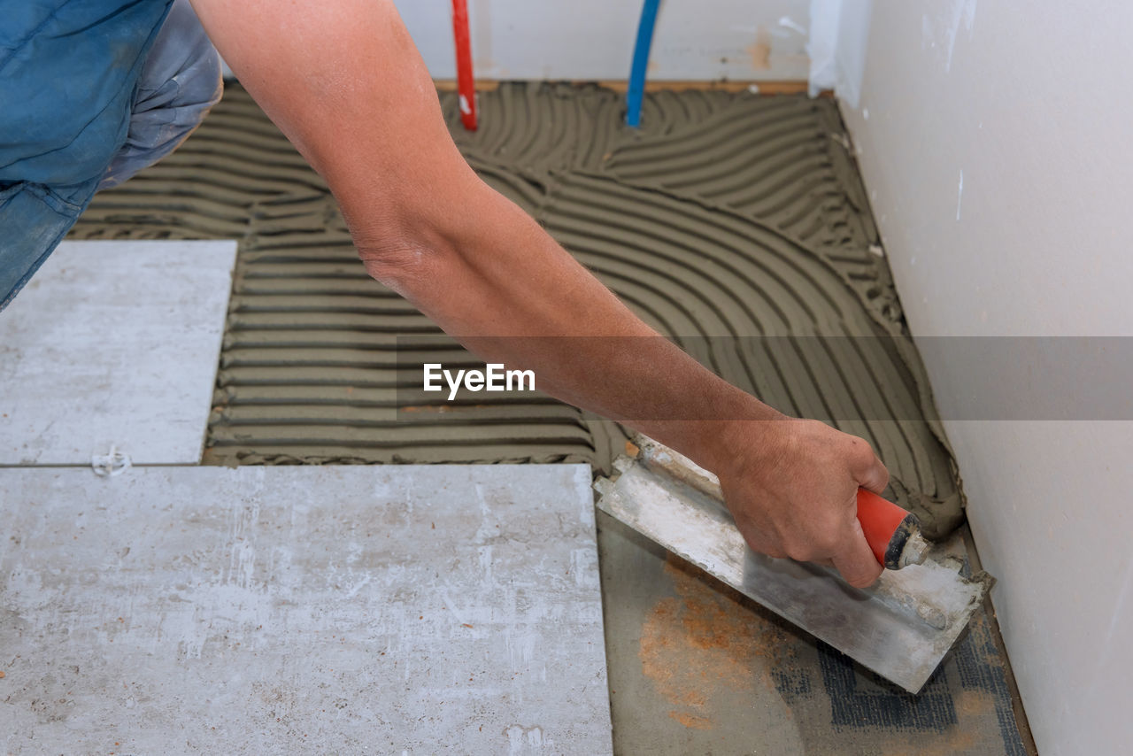 low section of man working at construction site