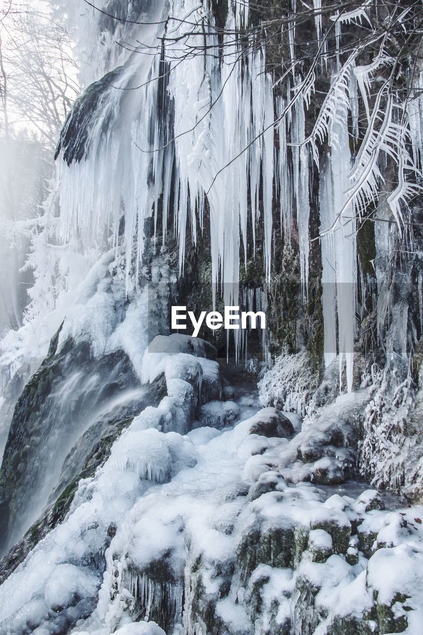 Frozen waterfall in forest