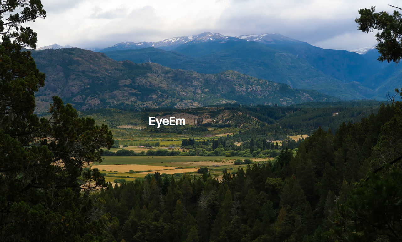 Scenic view of landscape and mountains against sky