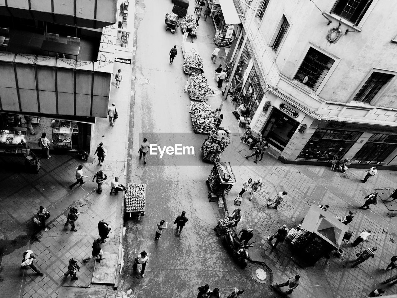 High angle view of people walking on city street