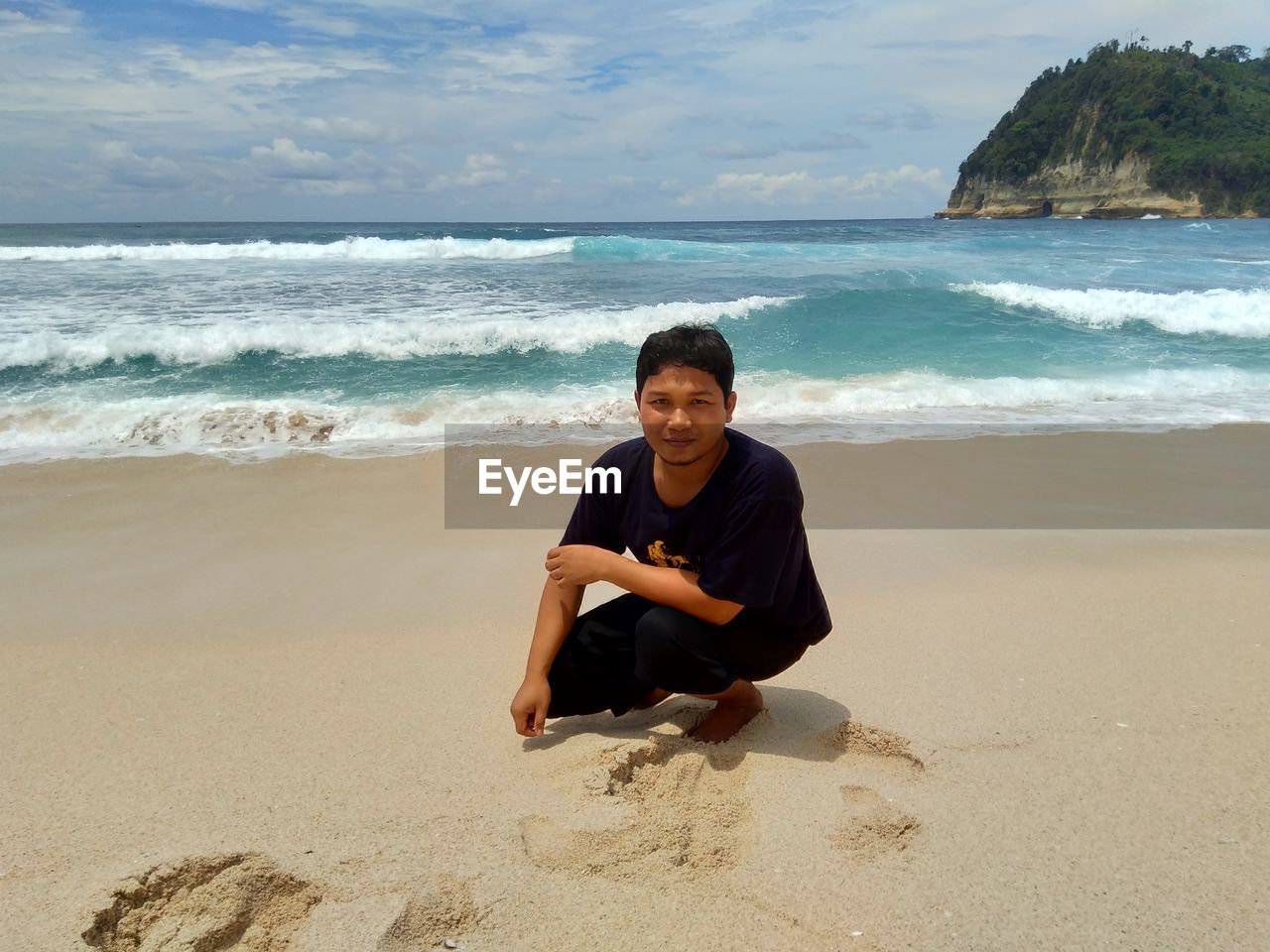 Portrait of smiling young woman on beach