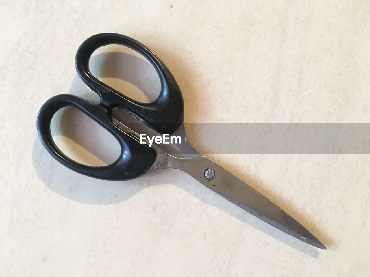 HIGH ANGLE VIEW OF SUNGLASSES ON TABLE AGAINST WHITE BACKGROUND