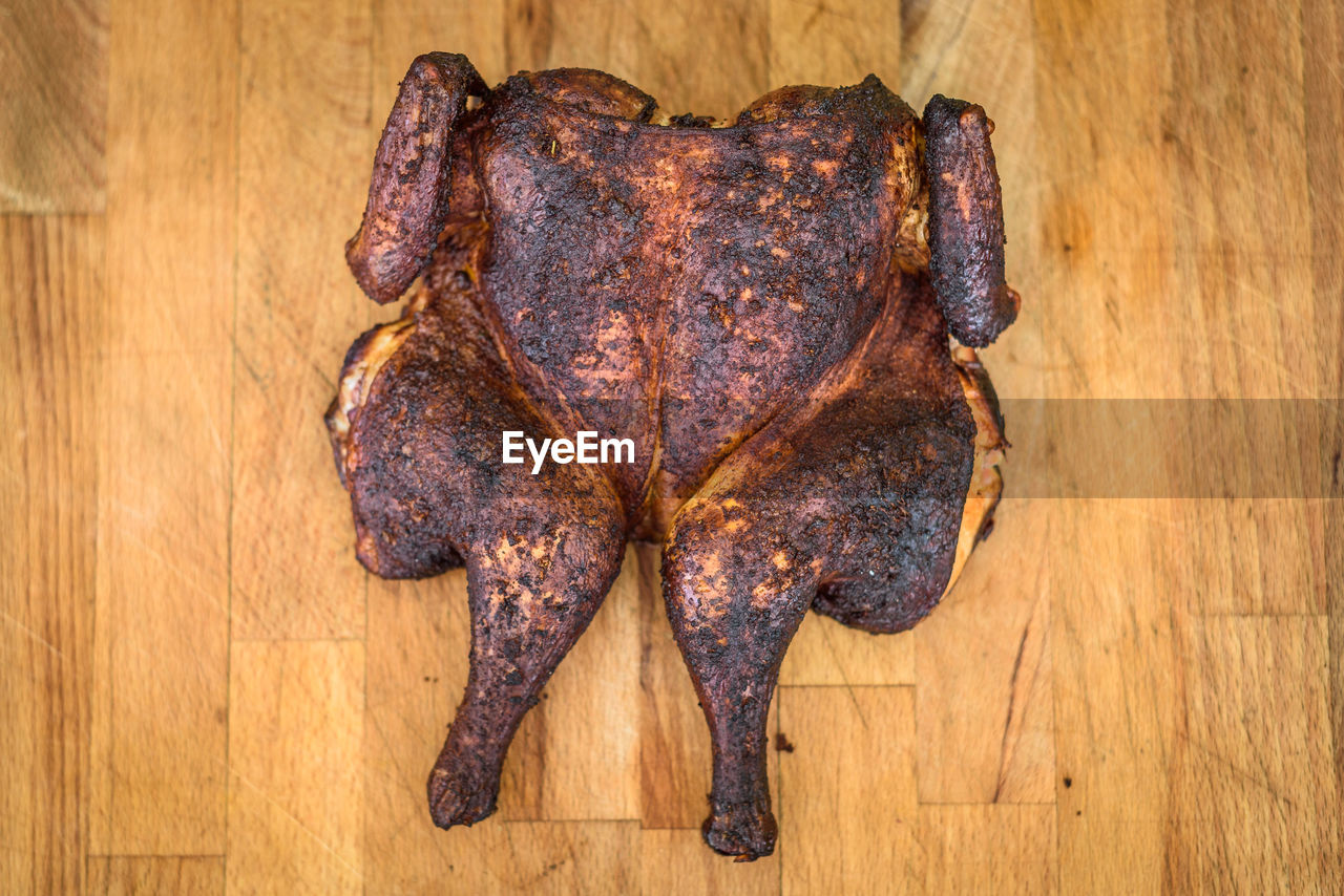 food and drink, food, indoors, directly above, wood, freshness, no people, wellbeing, animal, brown, high angle view, roast goose, leaf, roasted, still life, meat, healthy eating, table, close-up, animal body part, animal themes