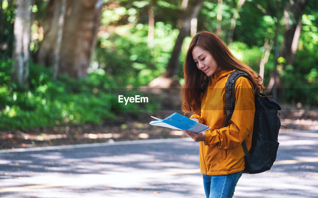 portrait of young woman using mobile phone