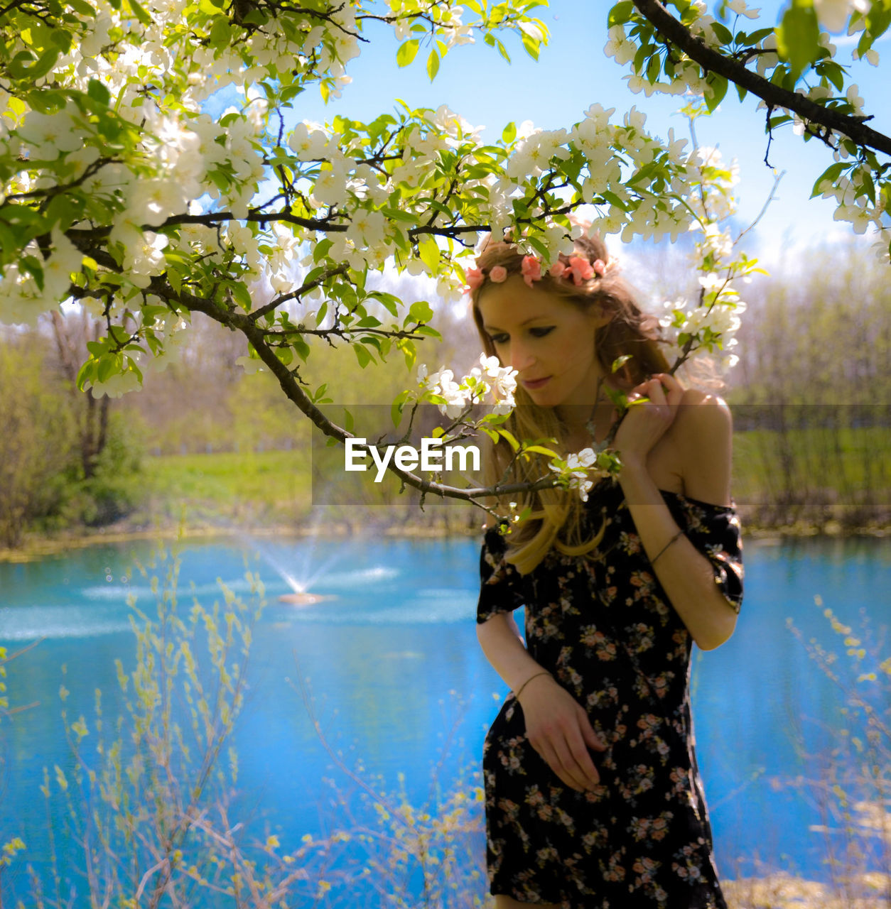 Woman by blooming tree