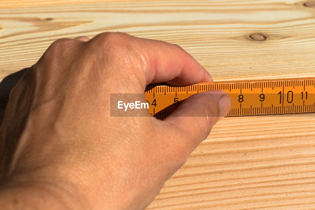 Close-up of human hand on table